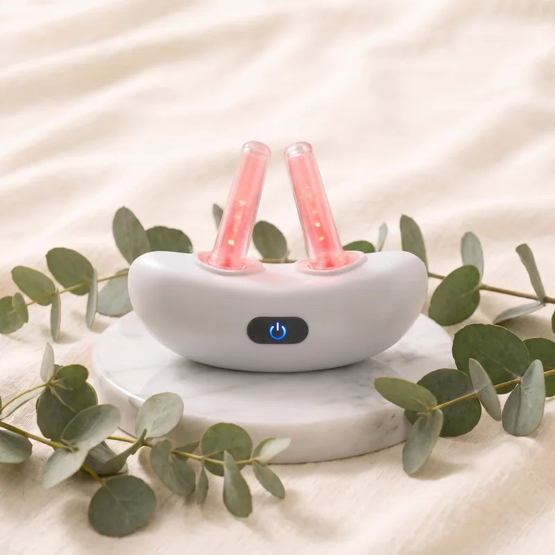 Vantrel Lumen on a marble stand with eucalyptus, both tips glowing red